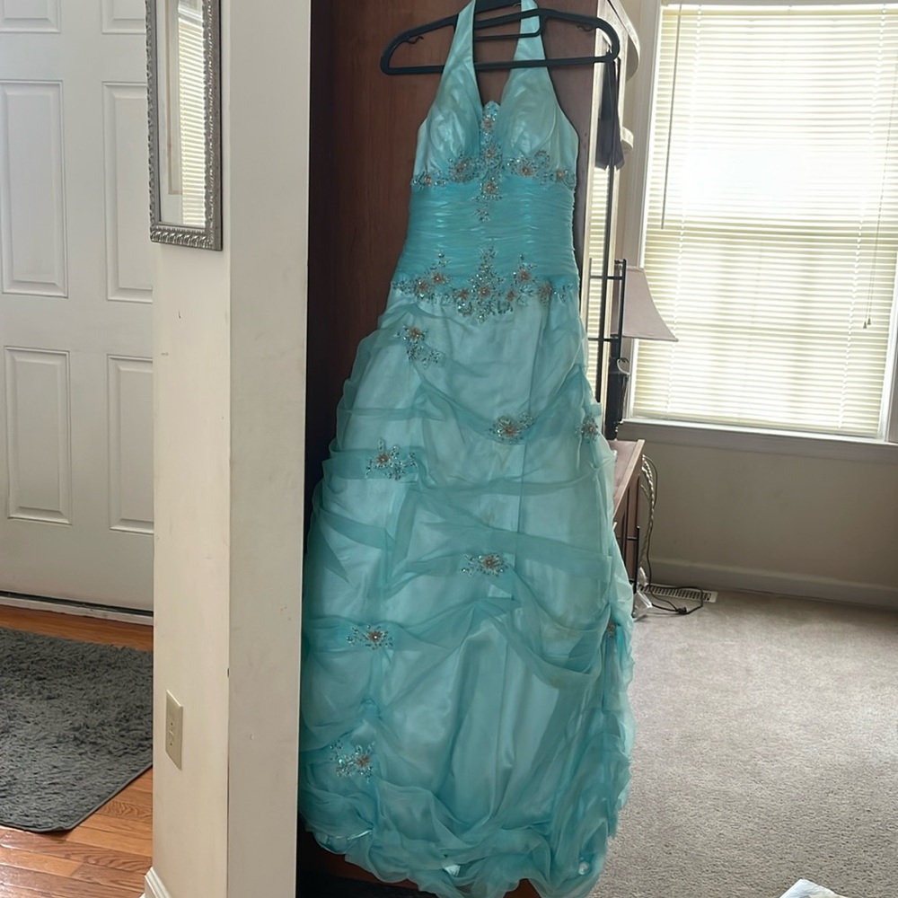 This dress was hemmed,fits someone who is 5 foot 4 inches,Requires gentle care.